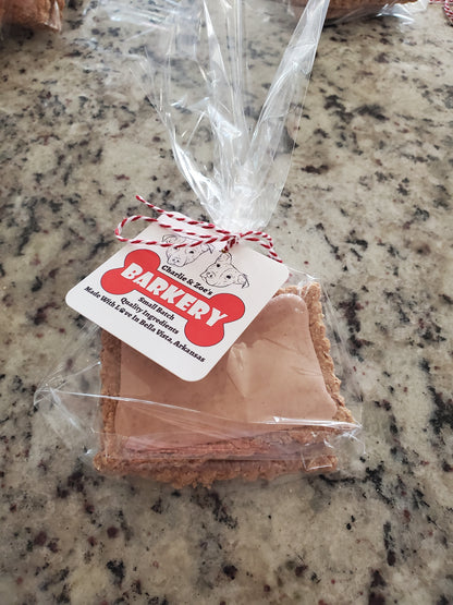 Strawberry puptart in plastic bag with Charlie & Zoe's Barkery tag