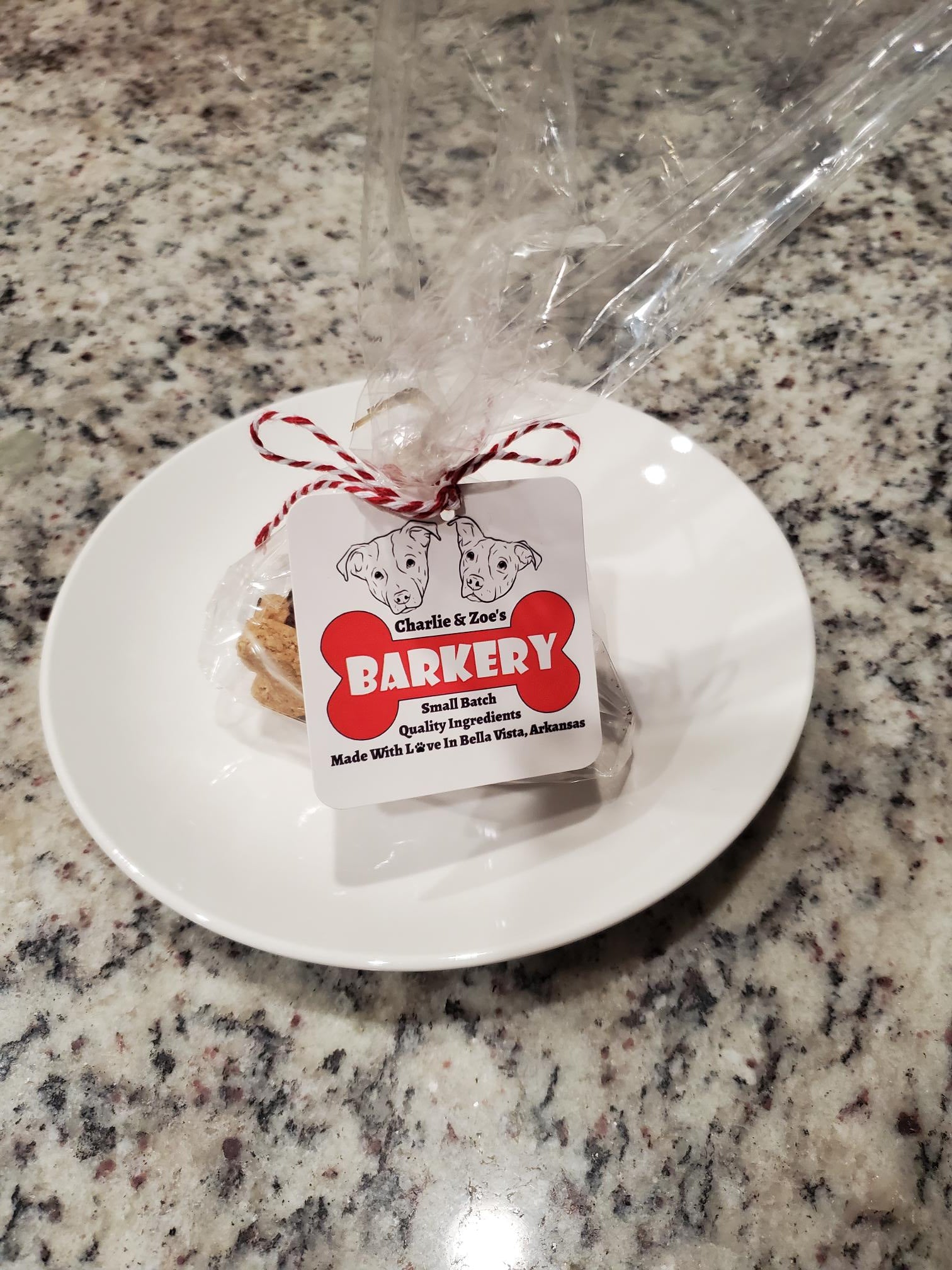 Dog treats in plastic bag with Charlie & Zoe's Barkery tag