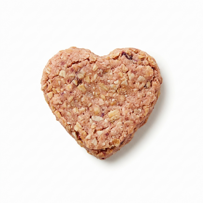 Heart-shaped dog treat on a white background